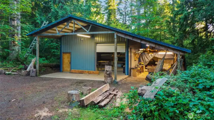 1300sf shop with tall garage door, 200 amp access, and large side carport--ready for your projects! Easy vehicle access from the 2nd driveway, on the side of the property.