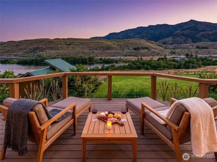 Experience seamless indoor-outdoor living! Step out onto the expansive deck to soak in sweeping views of the Methow River and surrounding mountains. This pristine Pateros home offers a riverside oasis, providing the perfect backdrop for entertaining guests or enjoying quiet, relaxing evenings under the sunset. Looking South. The photo has been virtually staged.