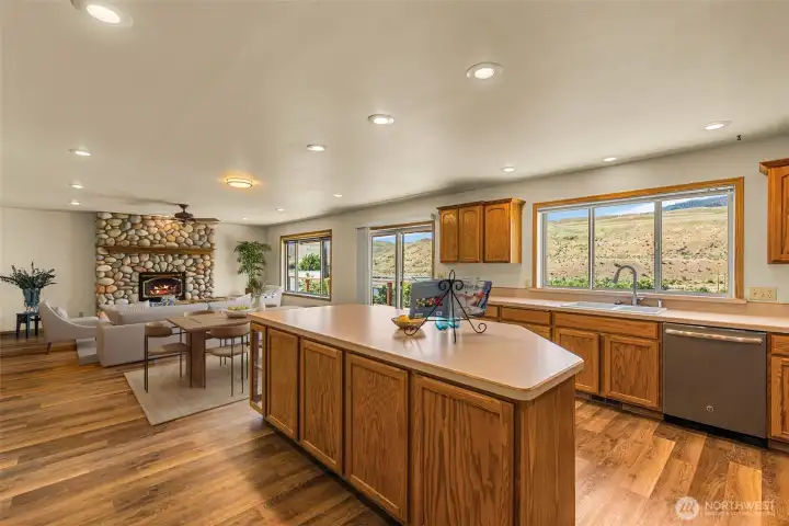 Enjoy never-ending views while cooking in this beautiful home. Whether you are watching the Methow River gently flow by or getting lost in your thoughts while looking at the majestic Billy Goat Mountain, you will not be disappointed by the incredible scenic backdrop this property offers. Photo virtually staged.