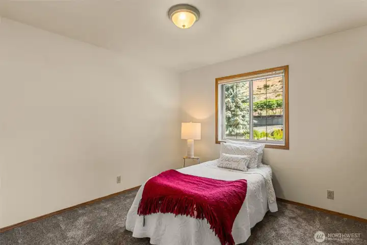 Discover comfort and privacy in Bedroom 1, thoughtfully situated on the North side. This well-sized bedroom provides generous space and flexibility, making it an ideal guest room, secondary bedroom, or peaceful private retreat.  The window looks toward the North yard.