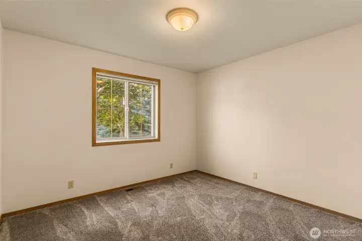 Bedroom 2 also looks toward the North yard, tucked away in the northeast corner. Bedroom 2 offers a quiet, relaxing space with direct views of the serene north-side yard. This well-sized bedroom provides generous square footage, perfectly complementing the flexible layout of this Methow Valley property.