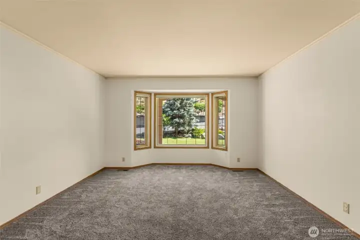 Centrally located adjacent to the kitchen, this large study looks out over the north-side front yard. Whether you envision your ideal home office or a dedicated playroom, this highly flexible space keeps you perfectly connected to the daily life of the home.