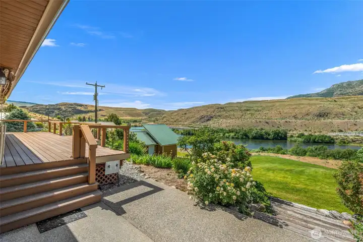Secret garden vibes meet waterfront living! This private backyard space is just waiting for your personal touches. Whether you want to host big summer parties or create a quiet personal oasis, the possibilities are endless. There is even the perfect concrete pad to add a hot tub—imagine warming up right here after taking a dip in the Methow River!