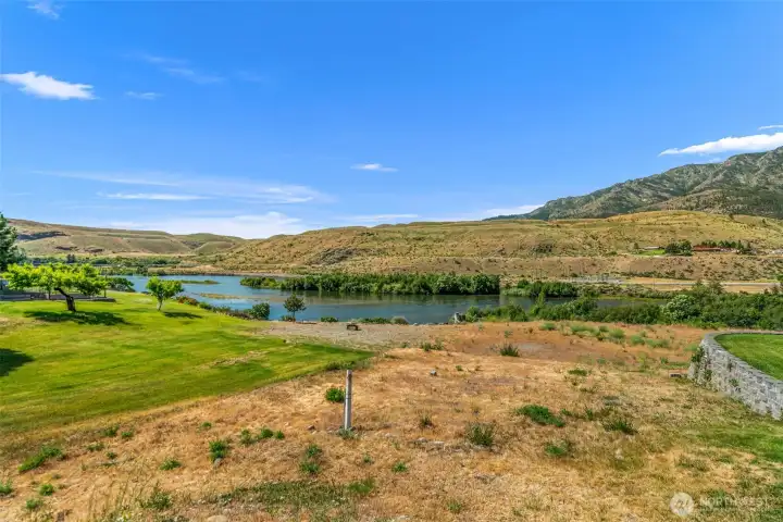 Enjoy the view from the front window of the she shed! Looking directly down the access path to the Methow River, this perspective highlights the incredible waterfront lifestyle and natural beauty.