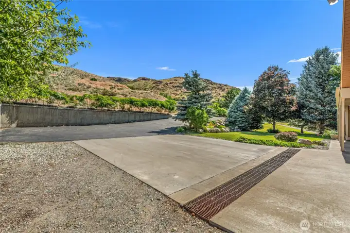 Space for all your toys! This Pateros property offers massive amounts of room for parking, featuring a large paved driveway and concrete pad. Bring your RV and boat.