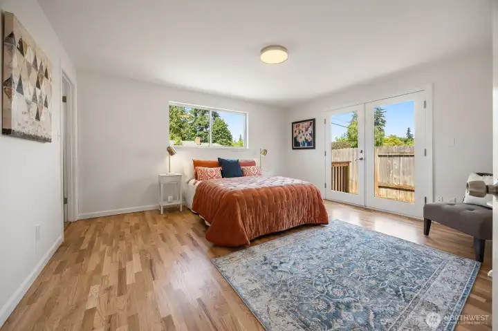Primary suite with 3/4 bath, walk-in closet and French doors out to the patio area. Just outside to the left is the water barrel. Primary suite with 3/4 bath, walk-in closet and French doors out to the patio area. Just outside to the left is the water barrel.