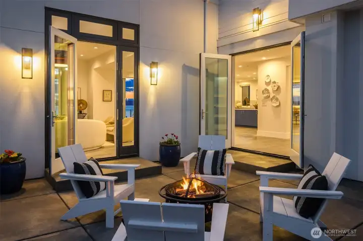 Known as the zen patio, a quiet respite surrrounded by greenery and views of sound through the home.