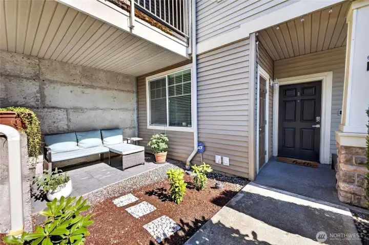 Front entry lovely sitting area to enjoy views of yard and private gardens