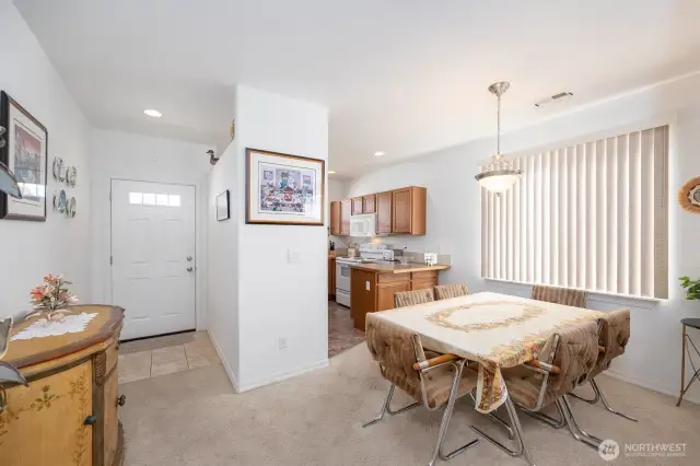 A view from the living room toward the Entry and Kitchen.