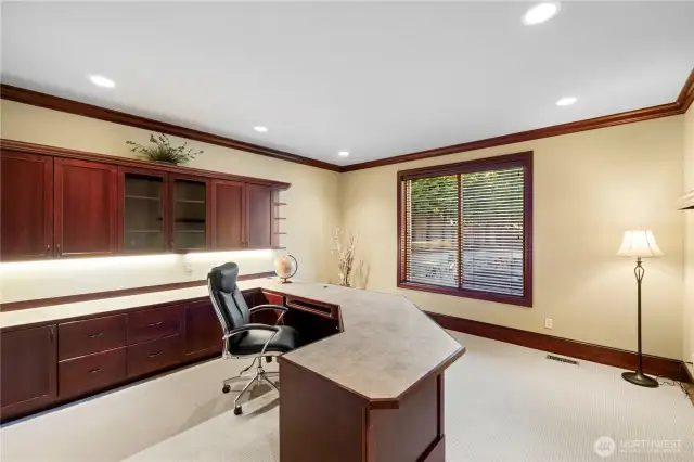 Home Office features built-in desk and storage cabinets