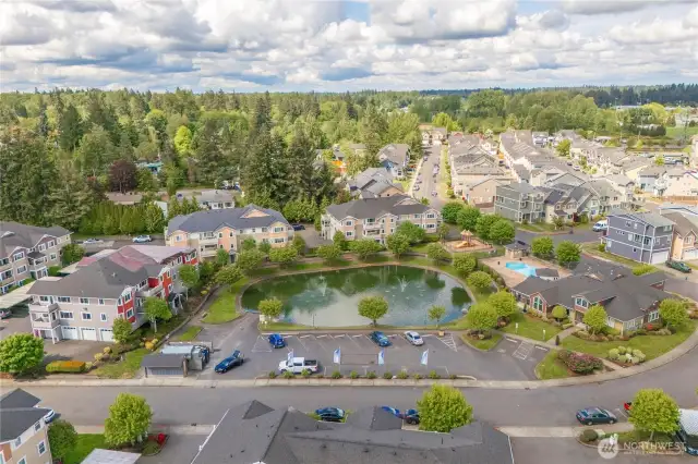 Your corner top floor unit is directly across the center of the pond.
