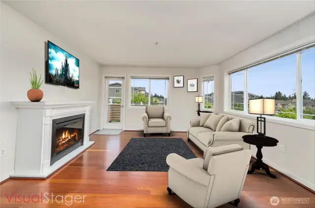 Bright open living room overlooking the peaceful pond, with a door to your private balcony. You will love the open floor plan here!