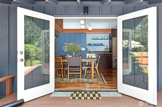 The dining area opens directly out to the freshly painted back deck. This home has wonderful connection to the outdoor spaces.