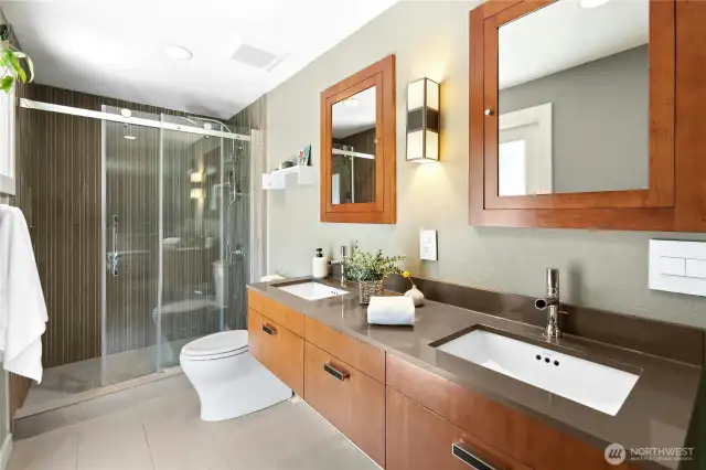 The primary bathroom with fresh updates and an over-sized shower. This room has a door out to the side yard. A great spot for a spa or sauna.