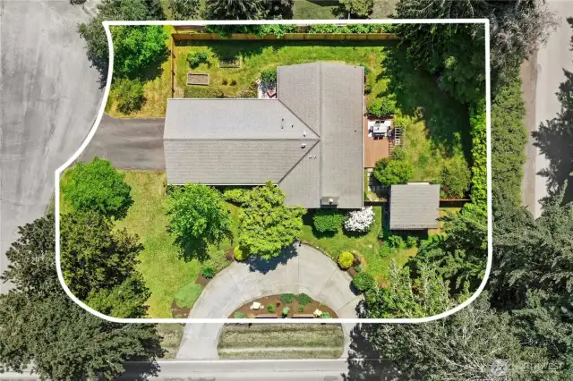An aerial view of the home and the .38 acre fenced lot.
