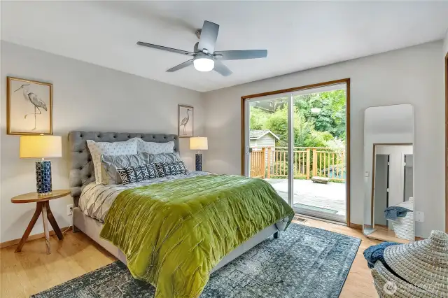 Primary bedroom, ceiling fan and deck access