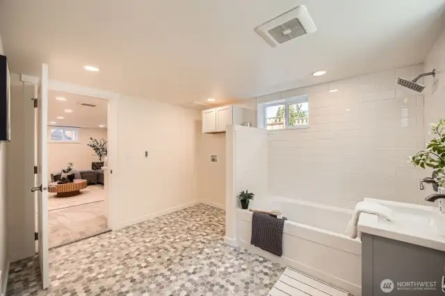Washer/Dryer hookup in this spacious lower level bathroom - new plumbing throughout the home.