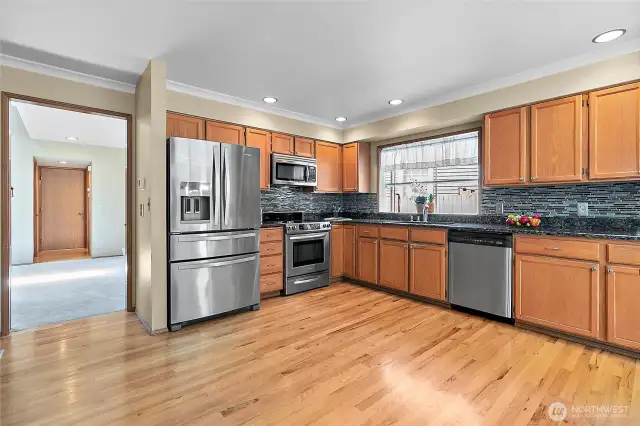 The kitchen boasts big open floor plan and lots of cabinets!