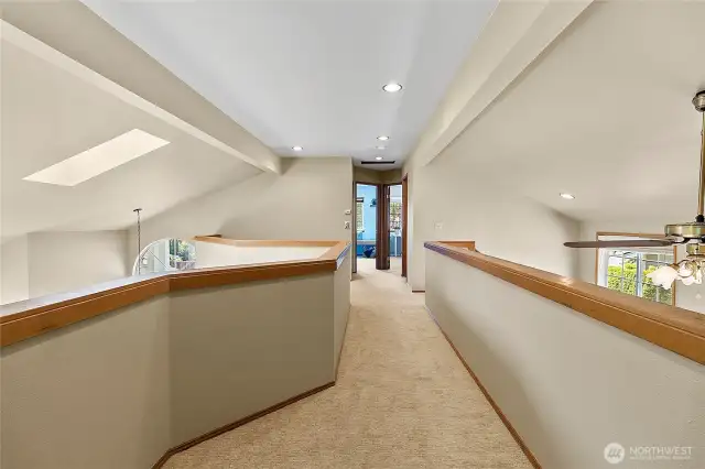 Enjoy the large Catwalk upstairs separating the primary bedroom from the 2 other bedrooms.  Gives the primary bedroom extra privacy.  Look at the lovely tall ceilings!