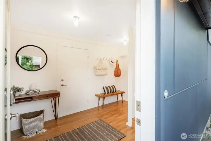 The first level features a spacious entryway with access to the attached 1-car garage and bonus storage.