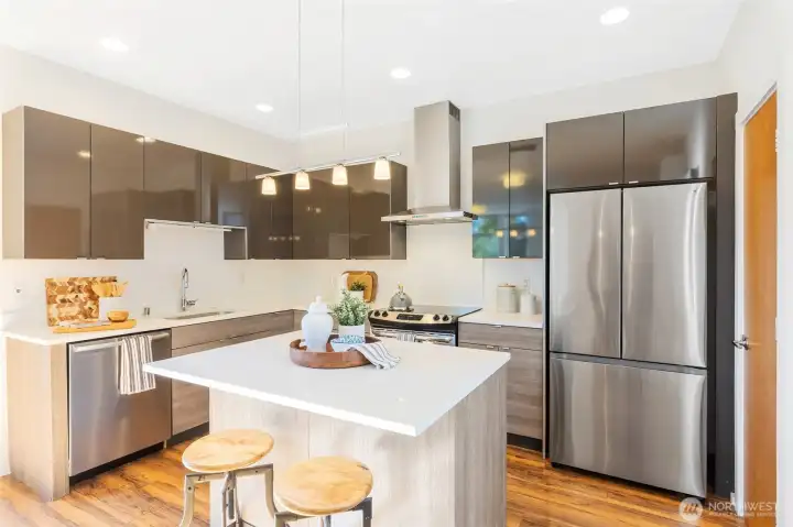 The island with counter seating is perfect for breakfast on the go or hosting friends for dinner.