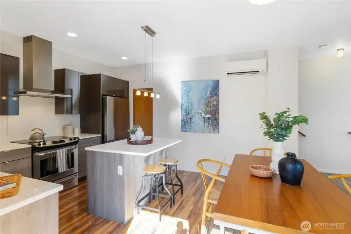 From here you can see the kitchen’s walk-in pantry, tucked just to the right of the fridge—perfect for storing all your favorite ingredients and snacks.