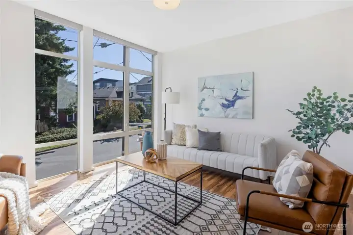 Natural light streams into the living room, making it the perfect spot for relaxing mornings or lazy afternoons.
