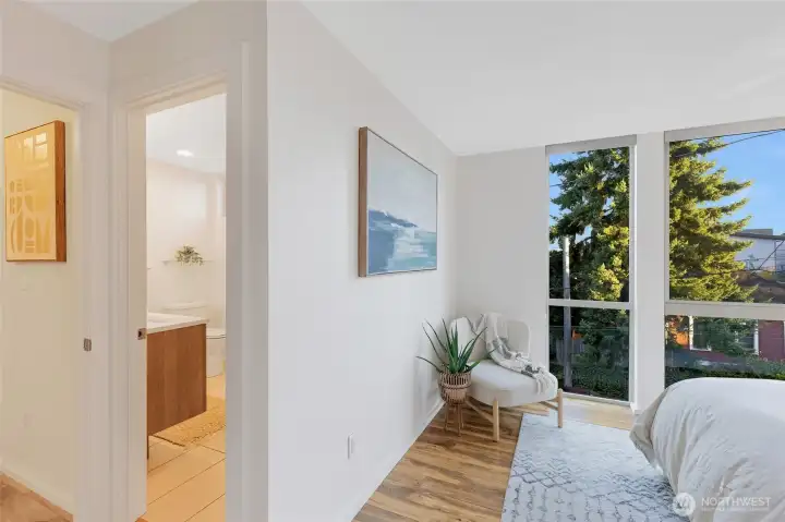 Turning the corner, you now see directly into the ¾ bath along with a glimpse of the hallway.