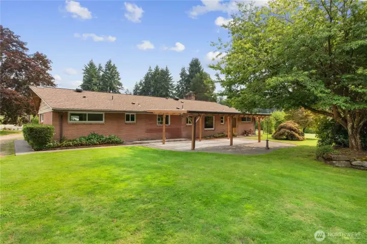 This spacious yard and generous sized covered patio are perfect for entertaining, barbeques, and gatherings. There is plenty of room for possible RV parking and surrounded by mature landscaping, making this home and lot truly special.