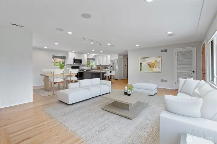 As you step inside, you will be greeted by the warmth of extensive gleaming hardwood floors and an open-concept layout that seamlessly connects the kitchen, dining and living areas. Newer remodeled kitchen with stunning finishes, this home offers both comfort and style. ADA Accessible