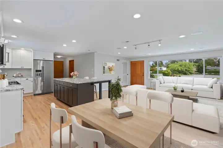 Open-concept living, dining and kitchen area- perfect for entertaining and gatherings. Bright, airy, and seamlessly connected, this space makes hosting a breeze and creates a warm, inviting atmosphere. ADA Accessible