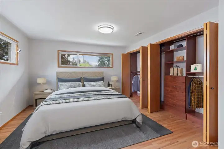 Beautiful primary suite with hardwood floors and large windows that fill the space with natural light. Featuring a spacious double closet and a luxurious, spa-like bathroom, this retreat offers comfort and style with every detail. ADA Accessible