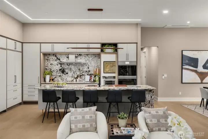 Dramatic Chef's Kitchen w/ Hidden Induction Cooking, Dual Smart Ovens & Statement Lighting.