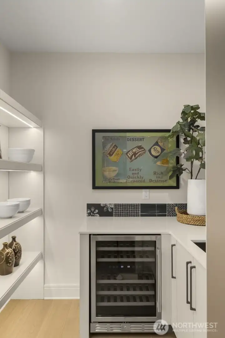 Hidden Prep Kitchen w/ Beverage Cooler, LED-Lit Pantry & Second Sink Convenience.