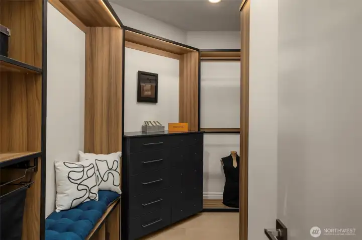 High-Design Primary Closet w/ Touch- Activated Hanging, Built-In Organization & Secure Bio-Safe.