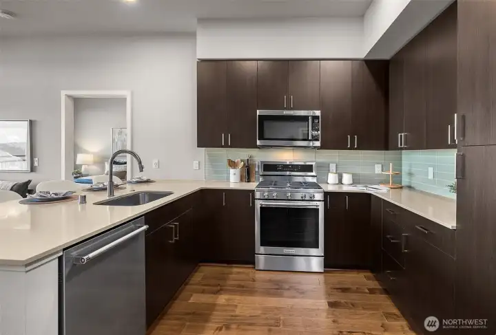 A sleek, gourmet kitchen showcasing stainless steel appliances, modern cabinetry, and high-end finishes—designed for both style and functionality.
