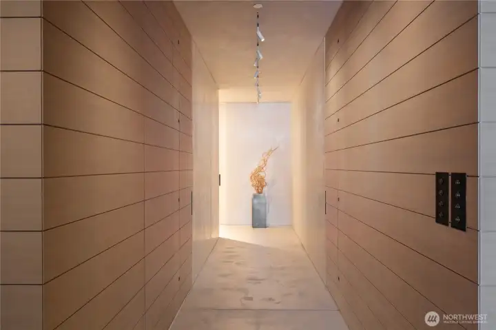 Dramatic main hallway with hidden access to a three quarter bathroom, flex guest space and primary suite.