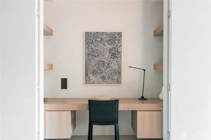 Convenient home office and storage tucked away behind hidden doors.