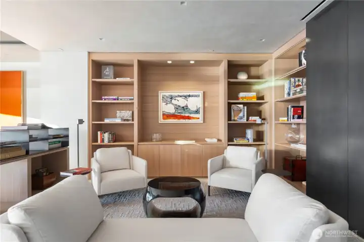 One of four flexible rooms, currently designed and arranged as a library~sitting room.