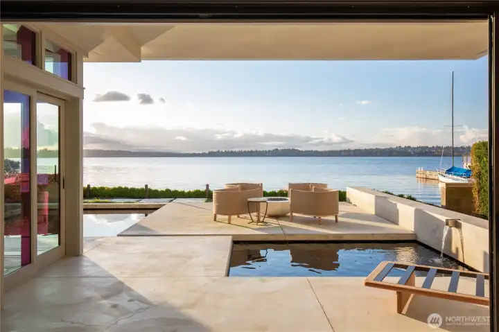 Multiple outdoor patios, built in gas fireplace and seating area..