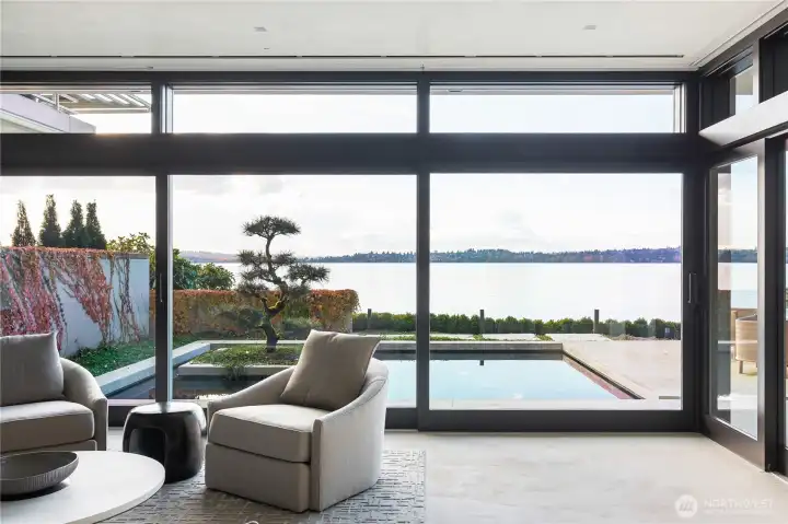 View from conversation~flex area looking out across one of two reflecting ponds and a Japanese Bonsai from Kubota gardens.