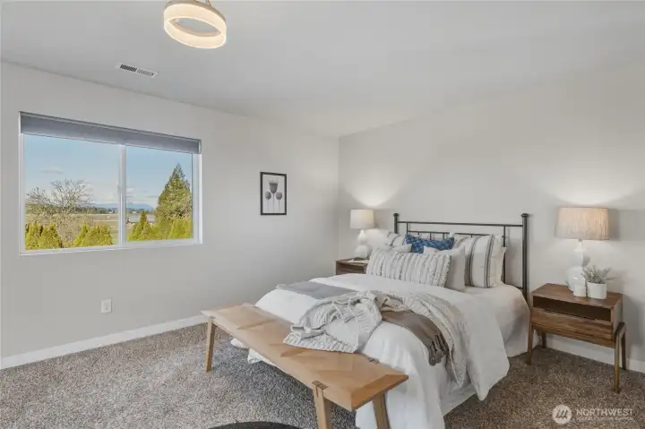 Plush carpeting, neutral tones, and abundant natural light create a calm, inviting space—perfect for rest and recharging. Ample room for a reading nook, yoga mat, or nursery corner.