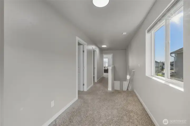 The primary suite is located at the North End of the home seperated by the bathrooms.