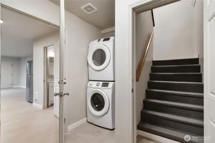 Stairs in rear lead to upstairs or another unit. Shared laundry