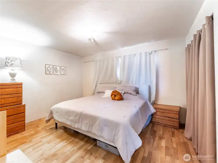 Comfortable primary bedroom with classic mid-century character.