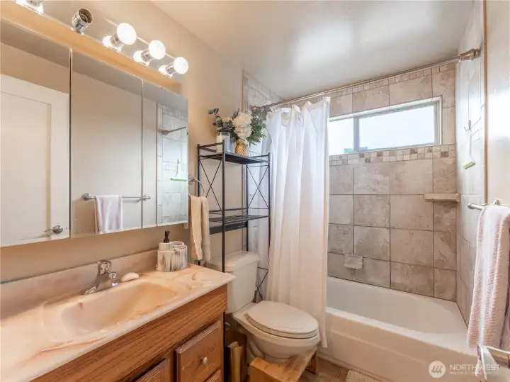 Updated main bathroom with clean finishes and functional design.