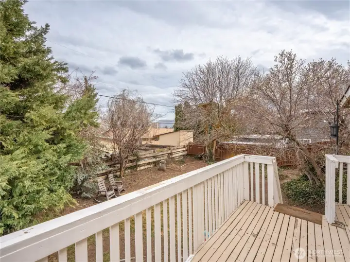 View of private backyard from deck.