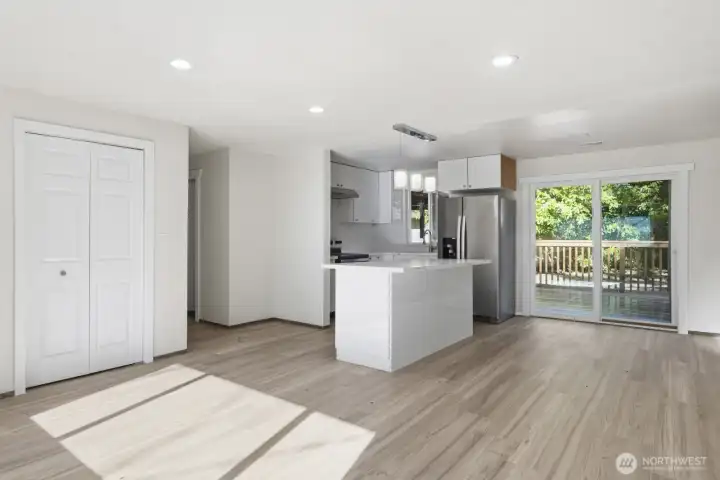 Beautiful LVP flooring in the family room and can lighting.