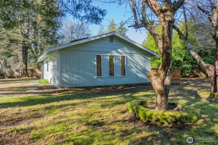 Another exterior view. The lot is partially fenced.