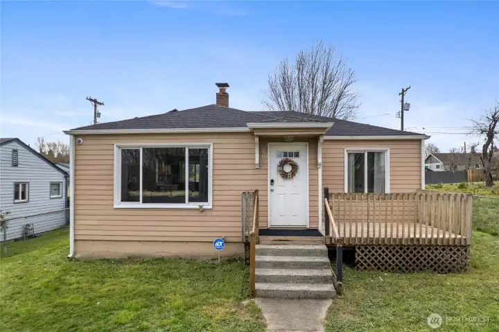 Front of home with large windows